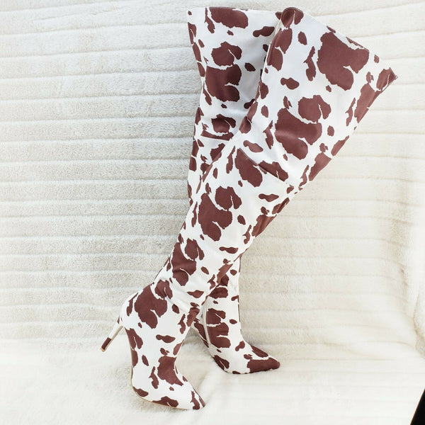 Cow print thigh high 2024 boots